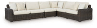Kimora 7-Piece Outdoor Wicker Sectional Set with Swivel Glider Lounge and Marble-Look Tables